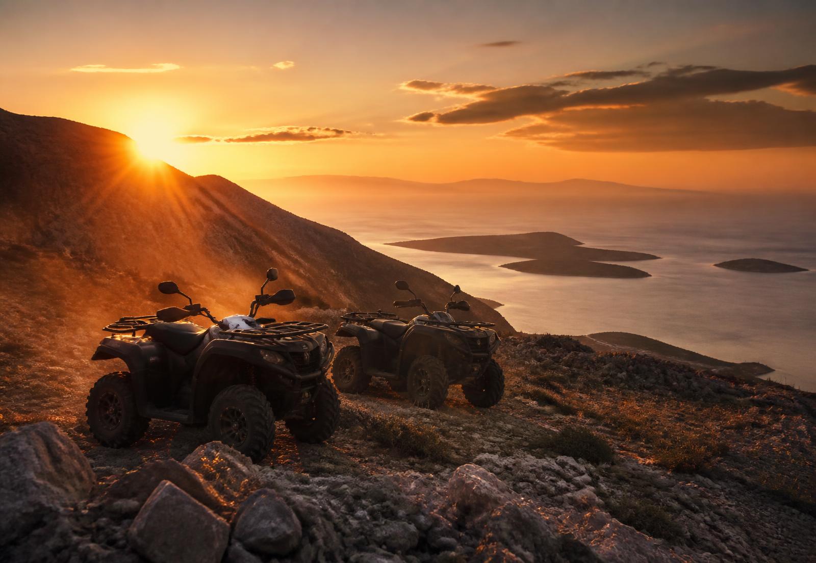 Quad bikes on a mountain ridge above the Adriatic at sunset near Split